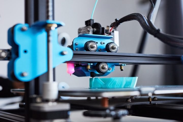 A 3D printer building a prototype in a research lab